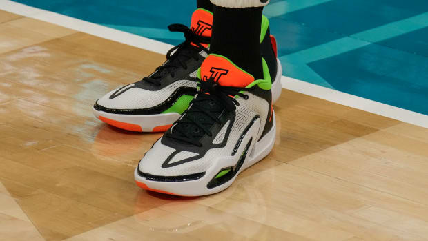 Boston Celtics forward Jayson Tatum's white and orange Jordan Brand shoes.